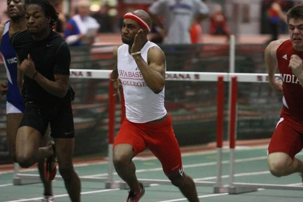 Emmanuel Aouad competing in hurdles.