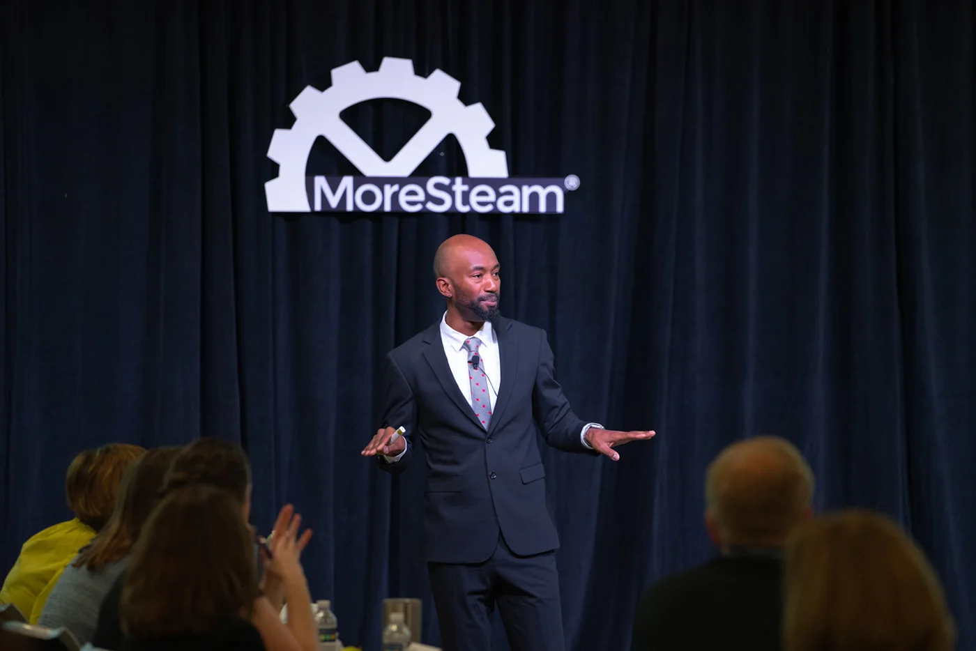 Emmanuel Aouad speaking at a conference.